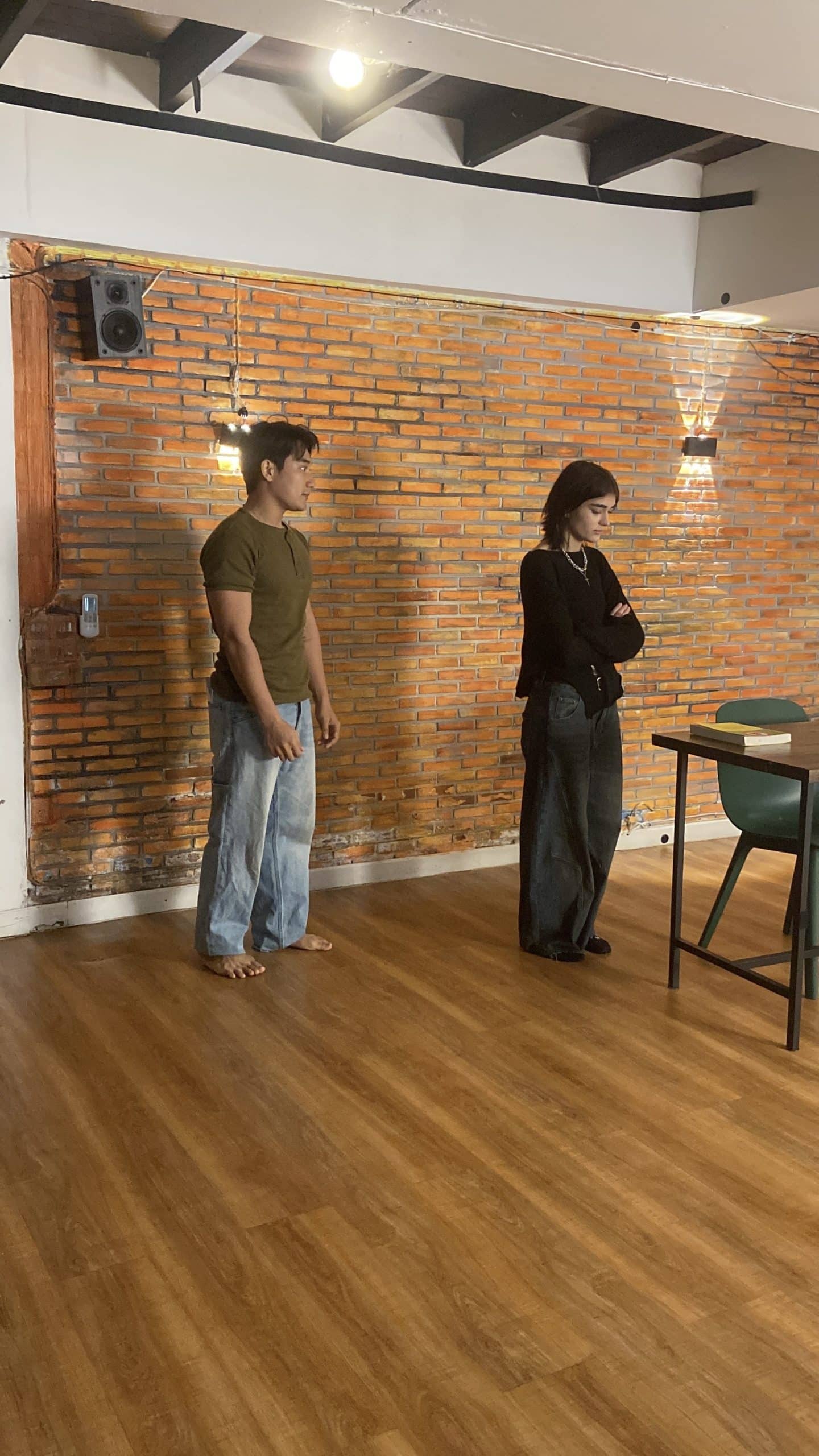 Confident actor performing energetically on a Bangkok TV ad set, highlighting talent.  

