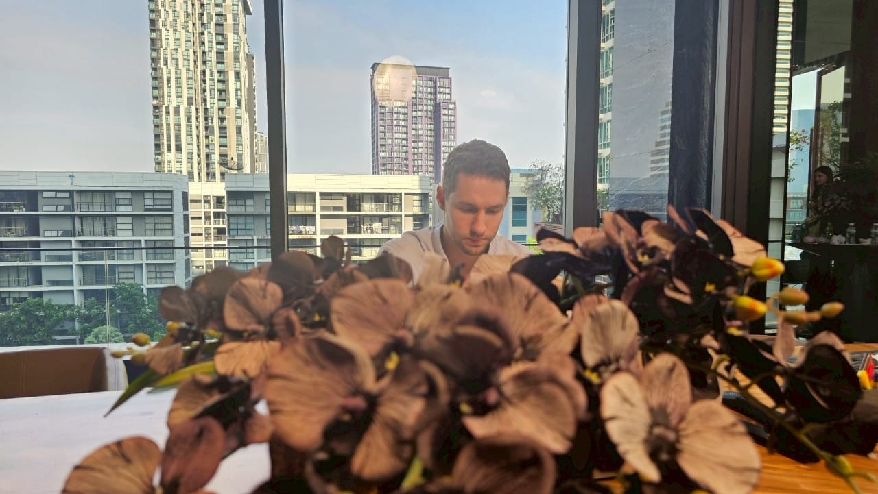 Bangkok ad set with models preparing for a commercial shoot, showcasing campaign energy.