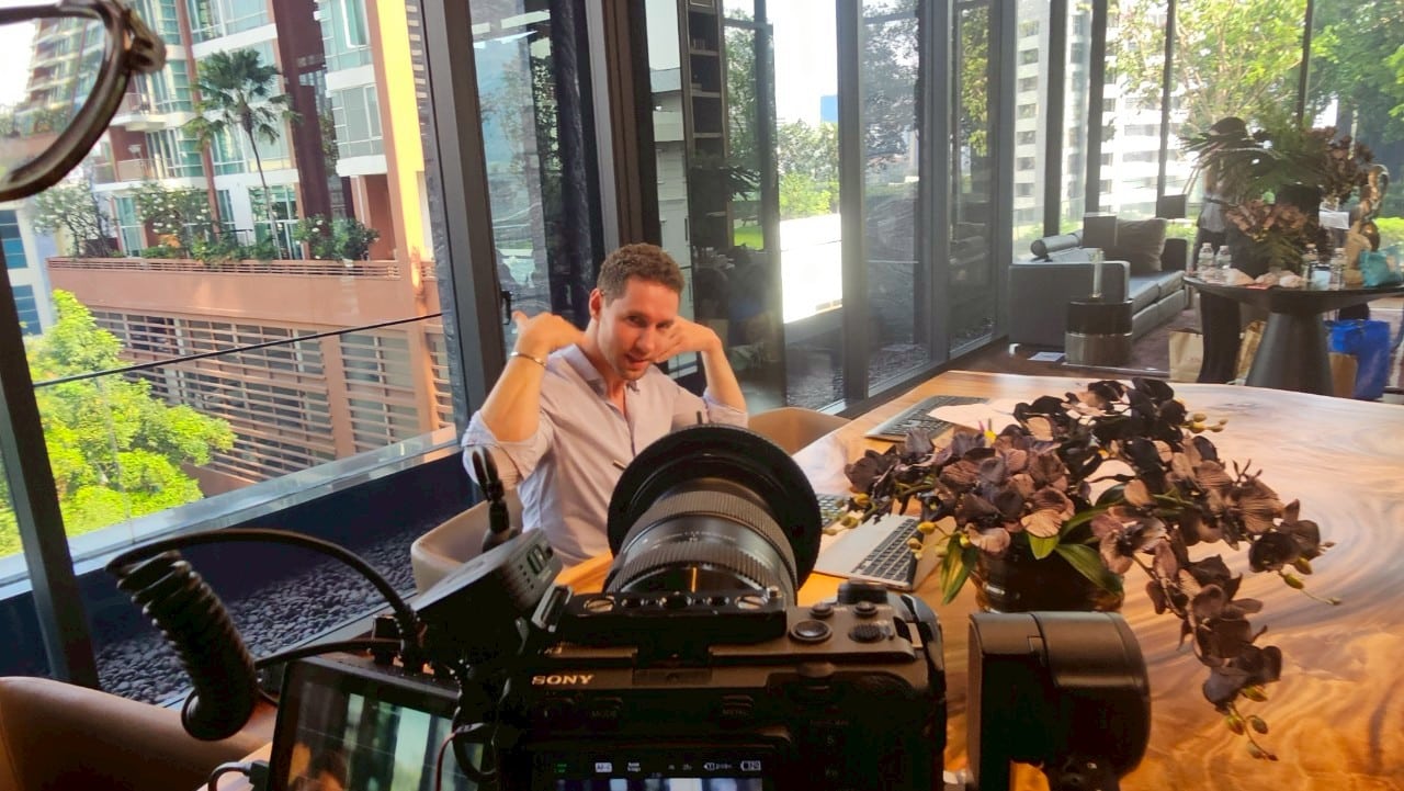 Thailand commercial set with professional models in action, showcasing campaign energy.