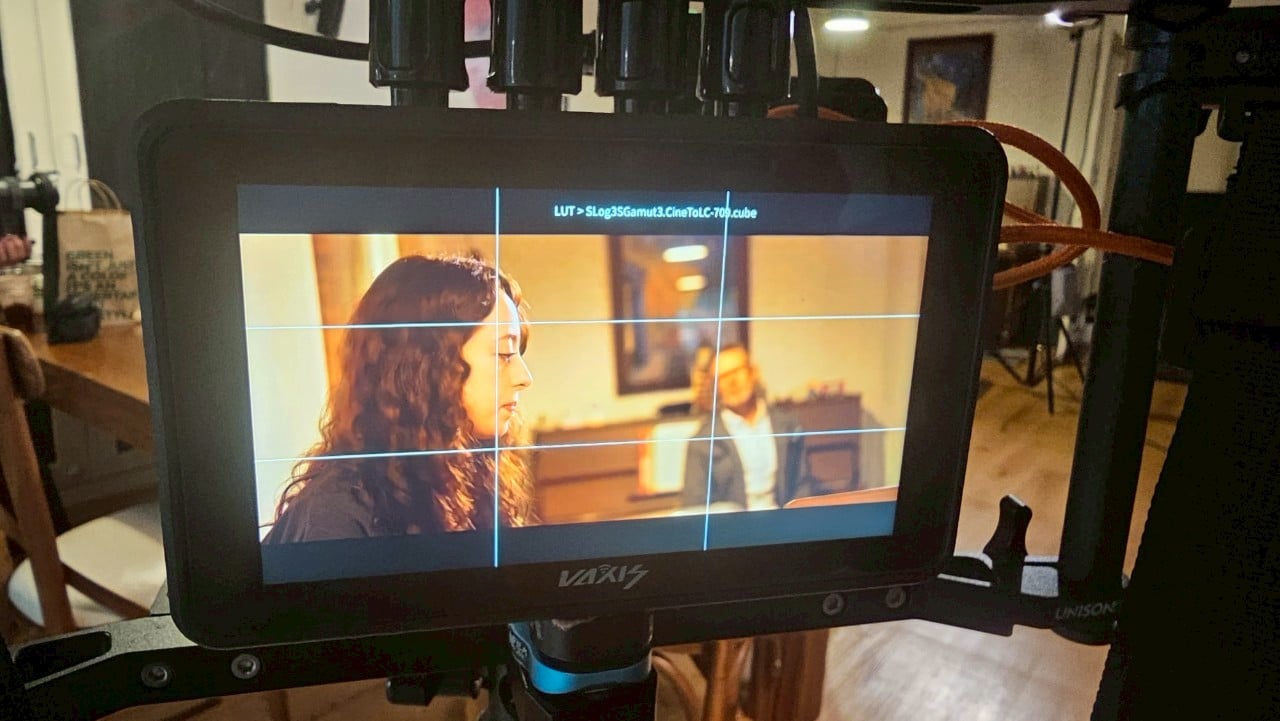 Lively Bangkok TV set with actors filming a series scene, showcasing TV energy.