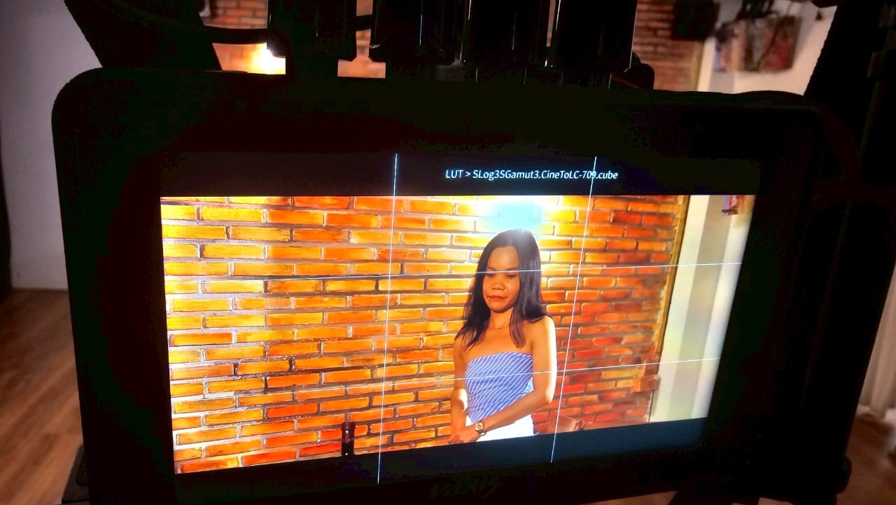 Multicultural cast rehearsing on a Bangkok film set, highlighting professionalism.