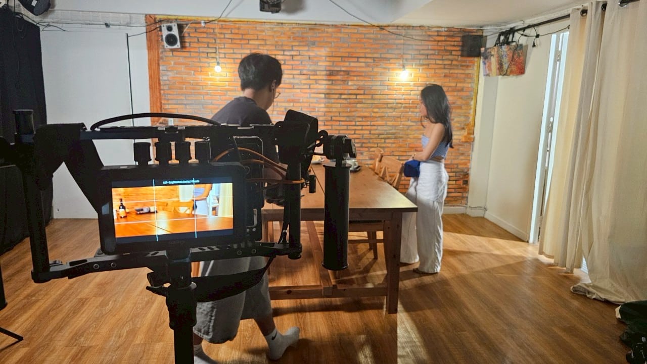 Thai actor performing passionately on a Bangkok TV set, highlighting talent.