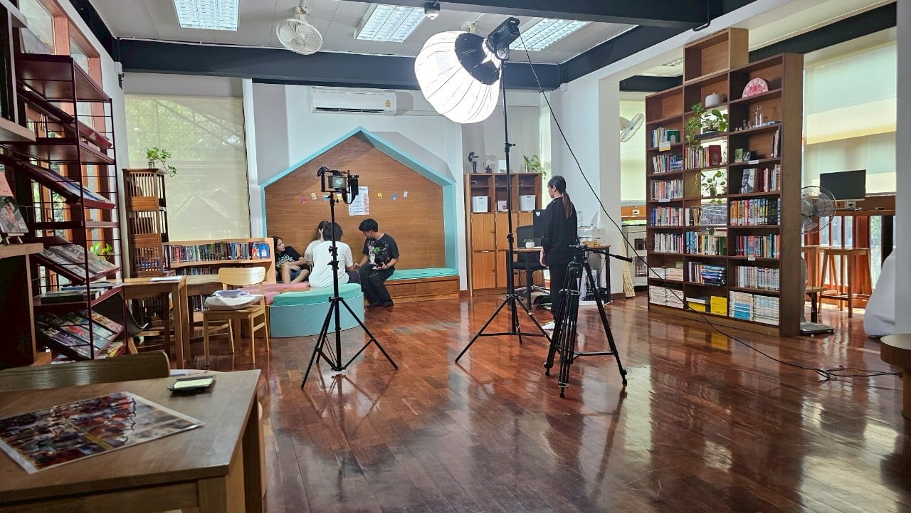 Vibrant Bangkok film set with actors and crew in action, showcasing cinematic energy.