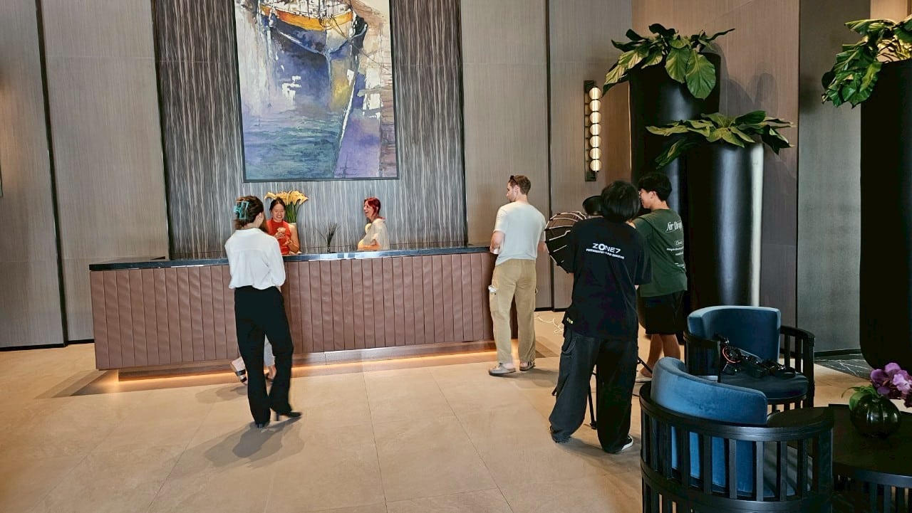 Multicultural model posing dynamically on a Bangkok set, highlighting talent.