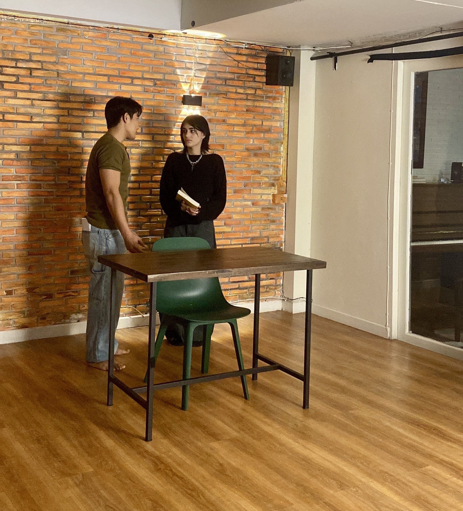 Multicultural actor rehearsing on a Bangkok film set, highlighting professionalism.